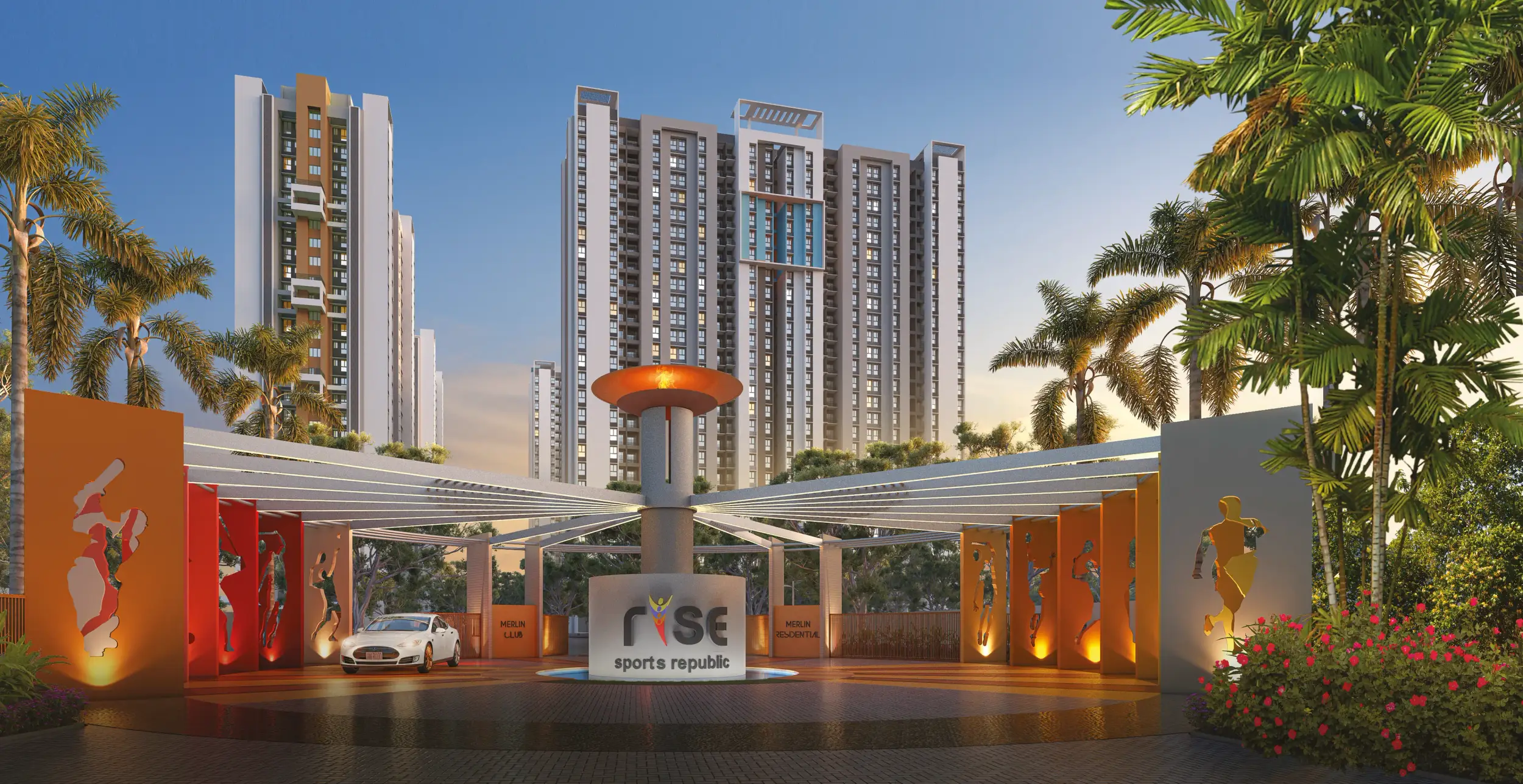 Front view of DTC Capital City featuring modern high-rise residential towers, landscaped greenery, and driveway with vehicles.