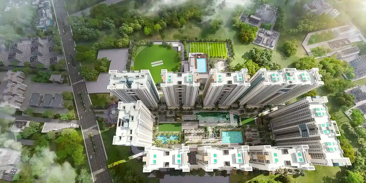 Merlin Rise residential towers along a wide six-lane expressway, featuring modern high-rise buildings surrounded by greenery.