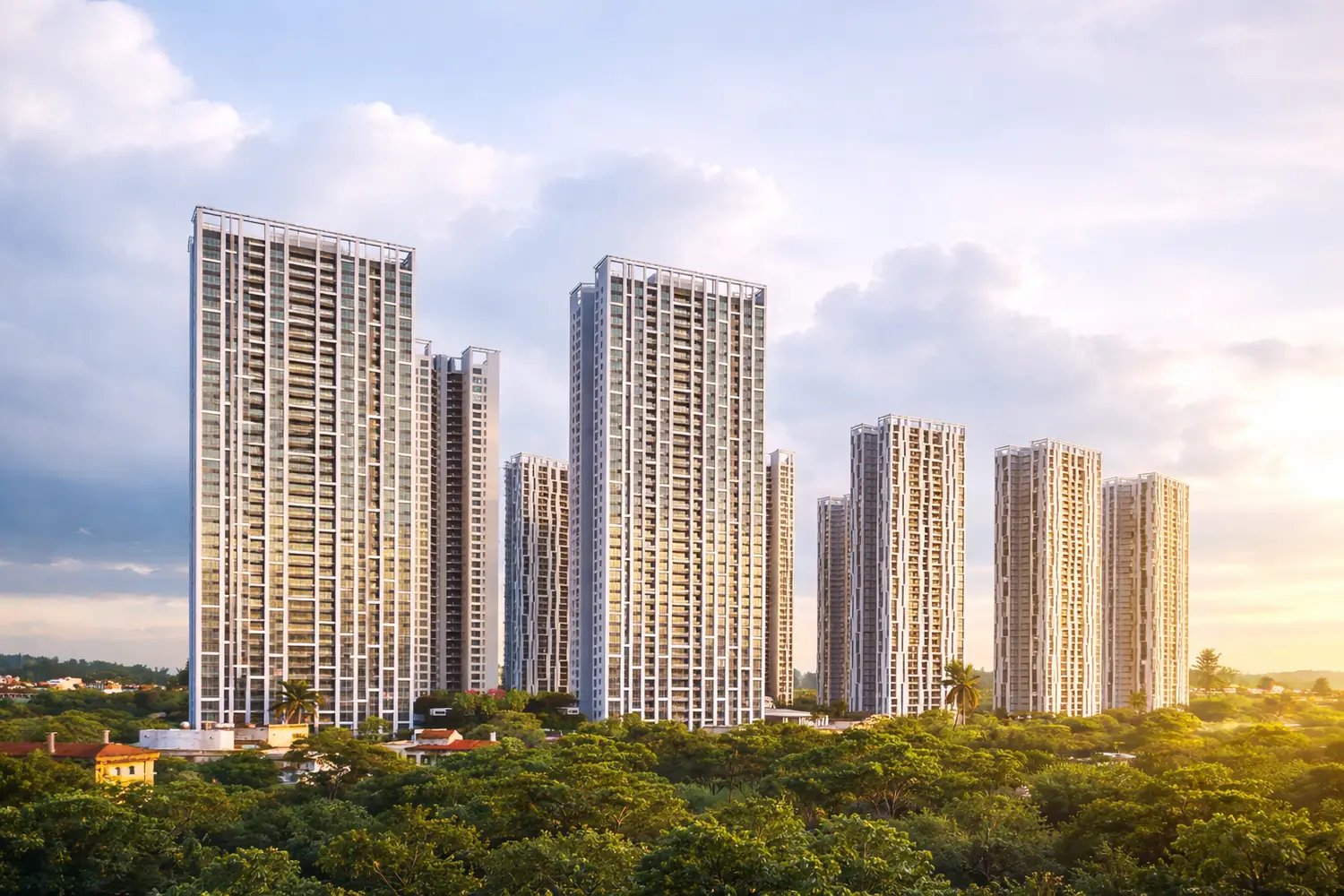 A cluster of modern high-rise residential towers at Urbana rising above lush green surroundings in Kolkata, illuminated by warm golden sunlight under a partly cloudy sky, showcasing a serene and upscale urban landscape.