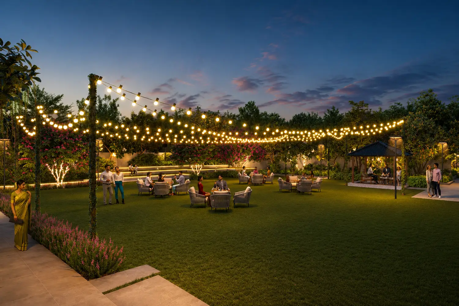 The Pravya party lawn with ambient lighting, gazebo, landscaped gardens, and outdoor seating.