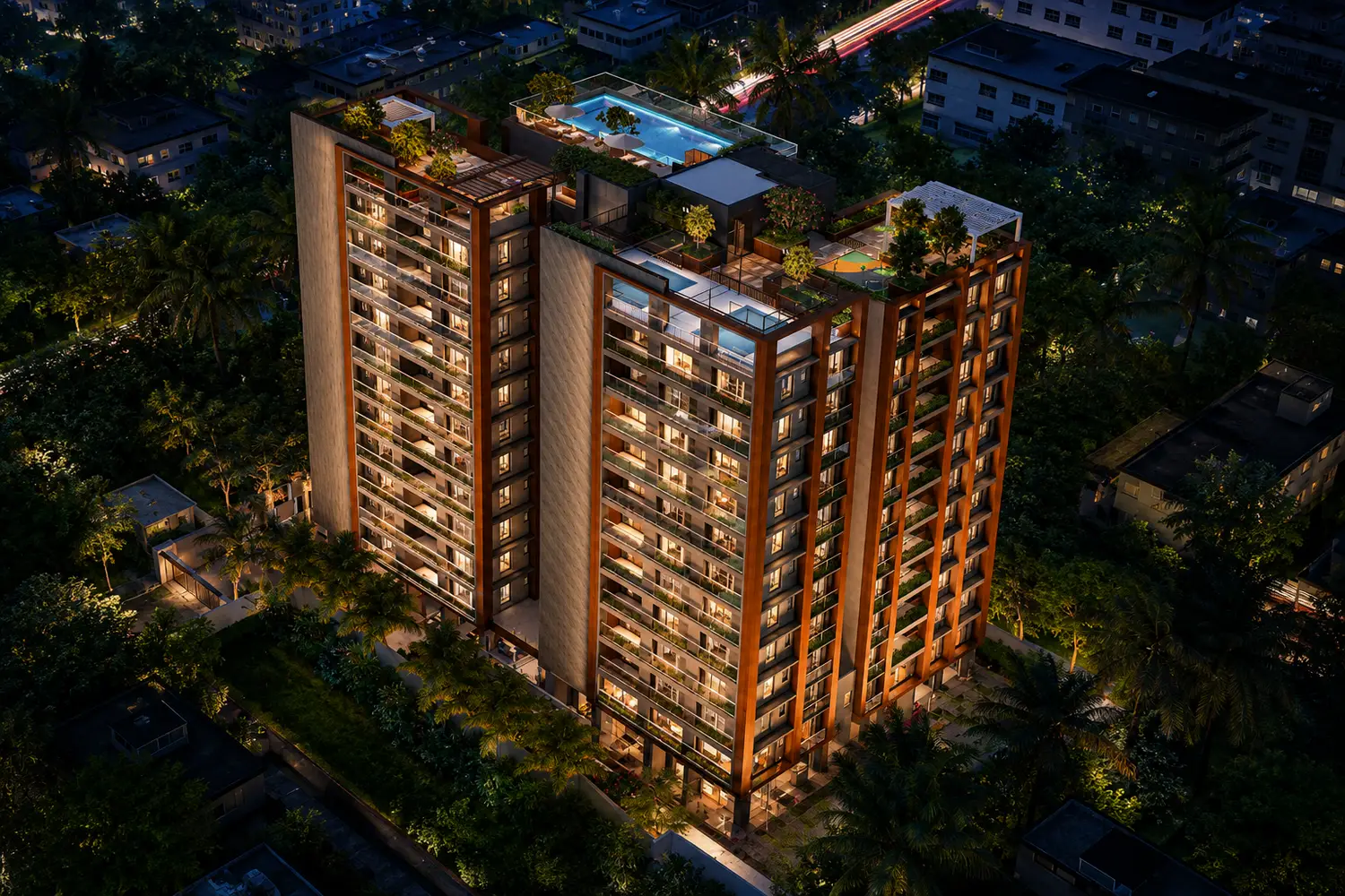 Aerial night view of Signum Niva in Alipore showcasing twin residential towers with illuminated façades, rooftop infinity pool, landscaped terraces and premium lifestyle amenities.