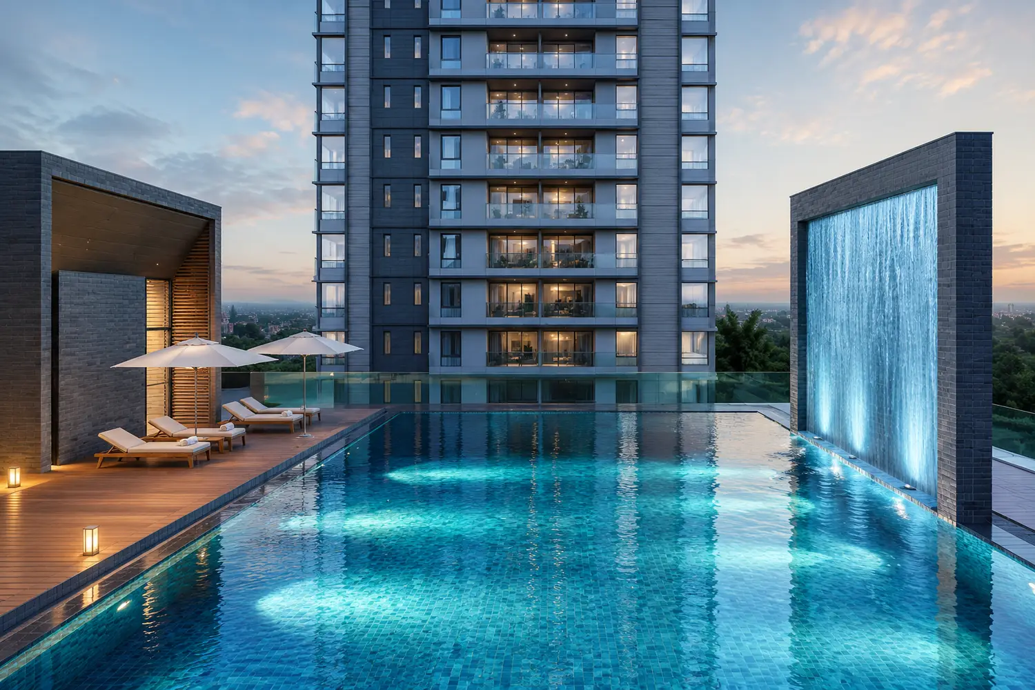 Infinity swimming pool at Salarpuria Inspire featuring a cascading water wall, poolside loungers and premium residential towers.