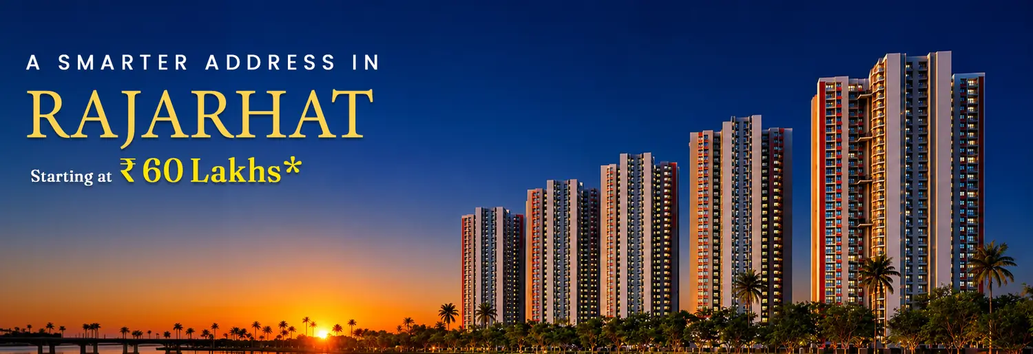 DTC Downtown residential project featuring four modern high-rise towers overlooking a serene waterbody at sunset, with illuminated floating lanterns, landscaped greenery, and a clear evening sky creating a premium urban waterfront ambiance.