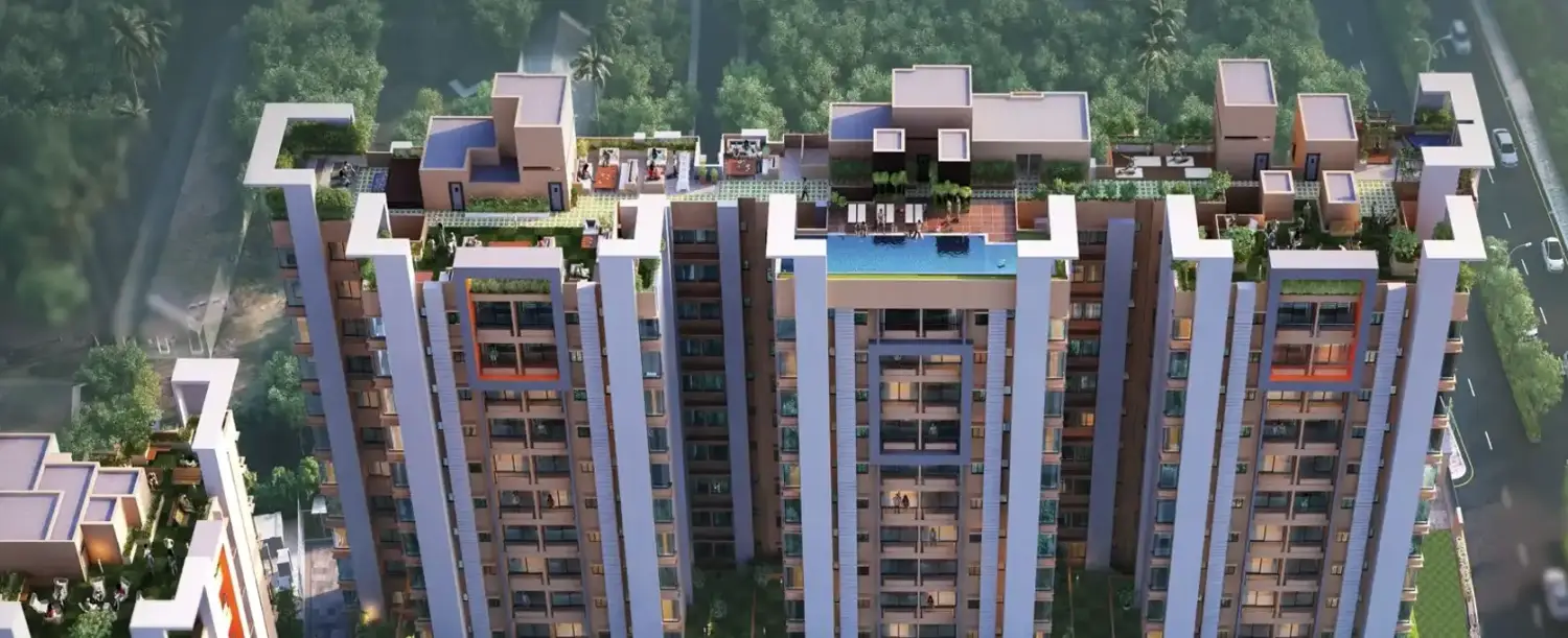 Aerial top view of the Rishi Ventoso residential project showcasing modern high-rise towers with rooftop amenities, landscaped terraces, a swimming pool and surrounding green cover.