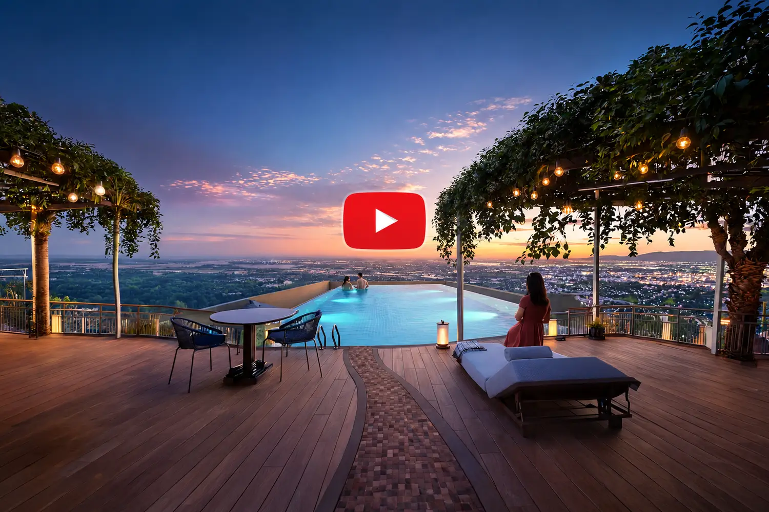Sunset view at Udyatt overlooking landscaped gardens, swimming pool, and modern high-rise apartment towers with an open city skyline.